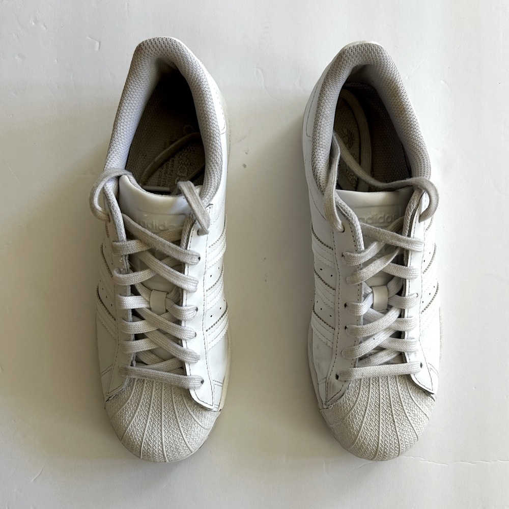 Women’s Adidas “ Superstar” tennis shoes.